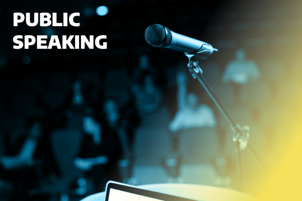 Public speaking image with a confident speaker addressing an audience or practicing presentation skills.